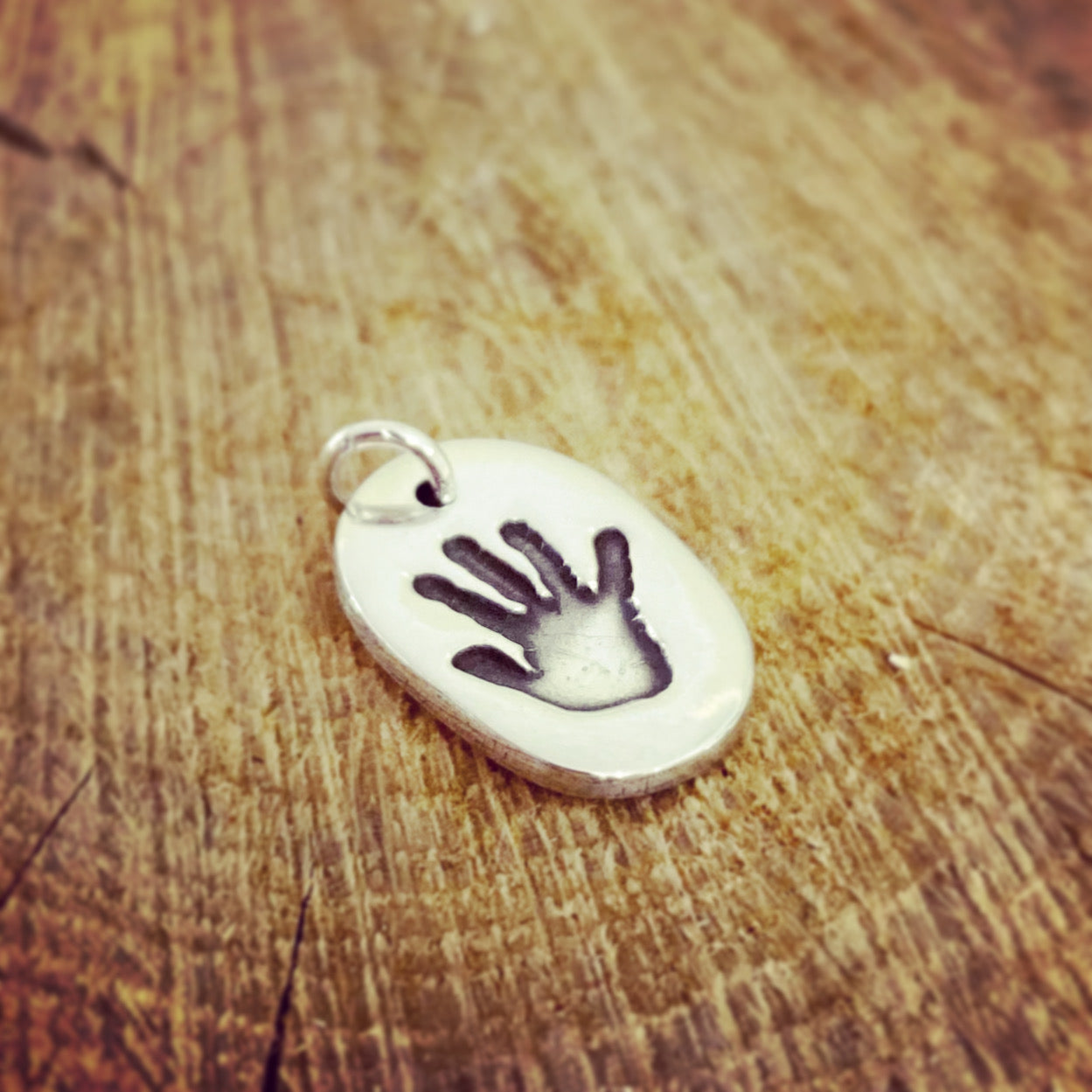 handprint oval charm