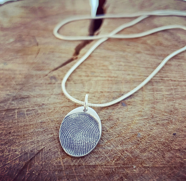 oval pendant on snake chain