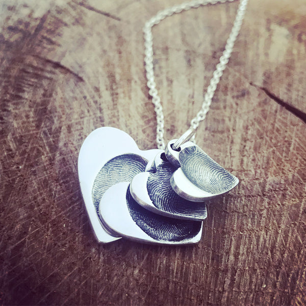 four cascading heart pendants on a belcher chain