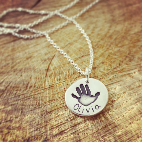 Handprint circle pendant on a belcher chain