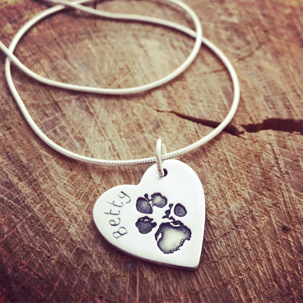 paw print heart pendant on a snake chain