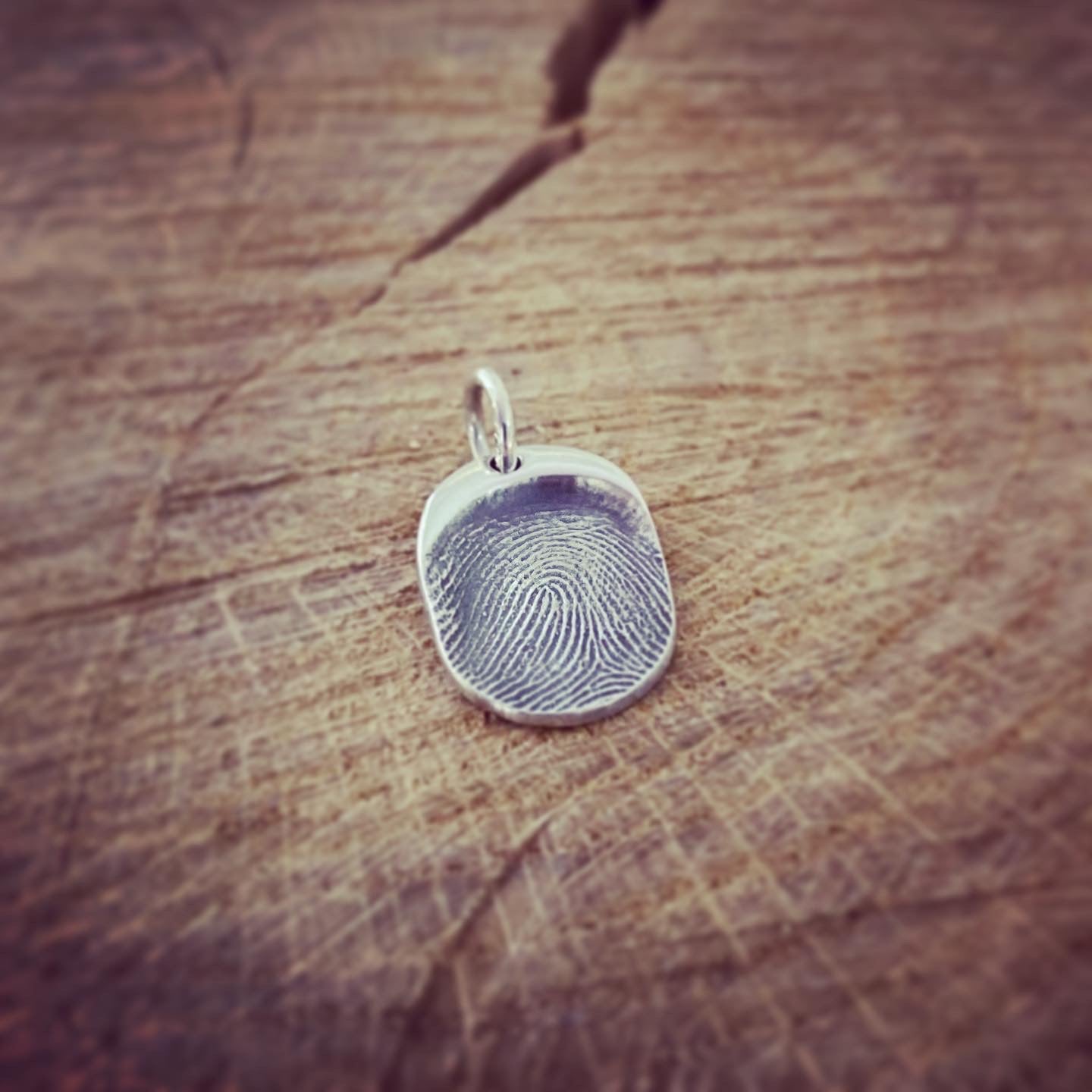 fingerprint oval charm