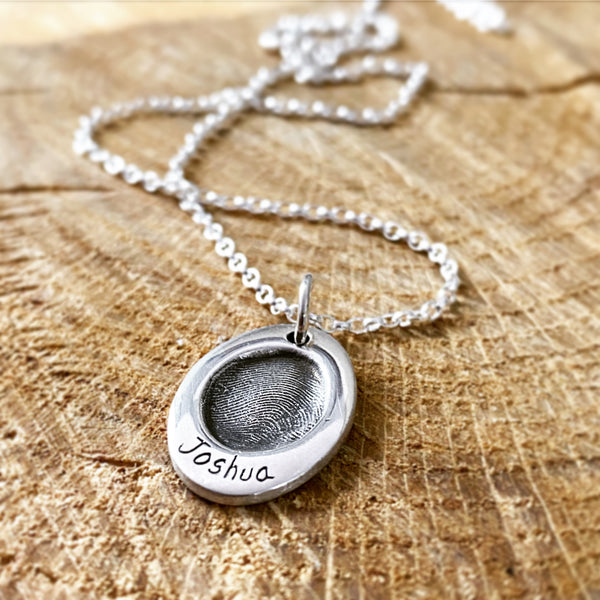 fingerprint oval pendant on a necklace