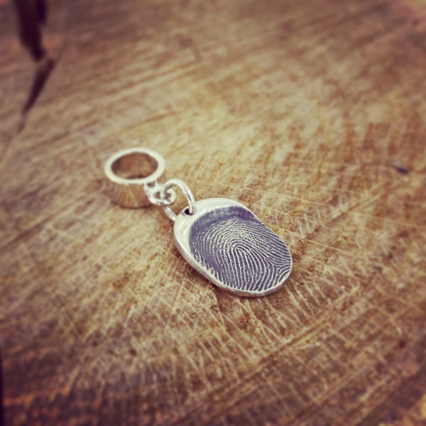fingerprint oval charm on a pandora bail